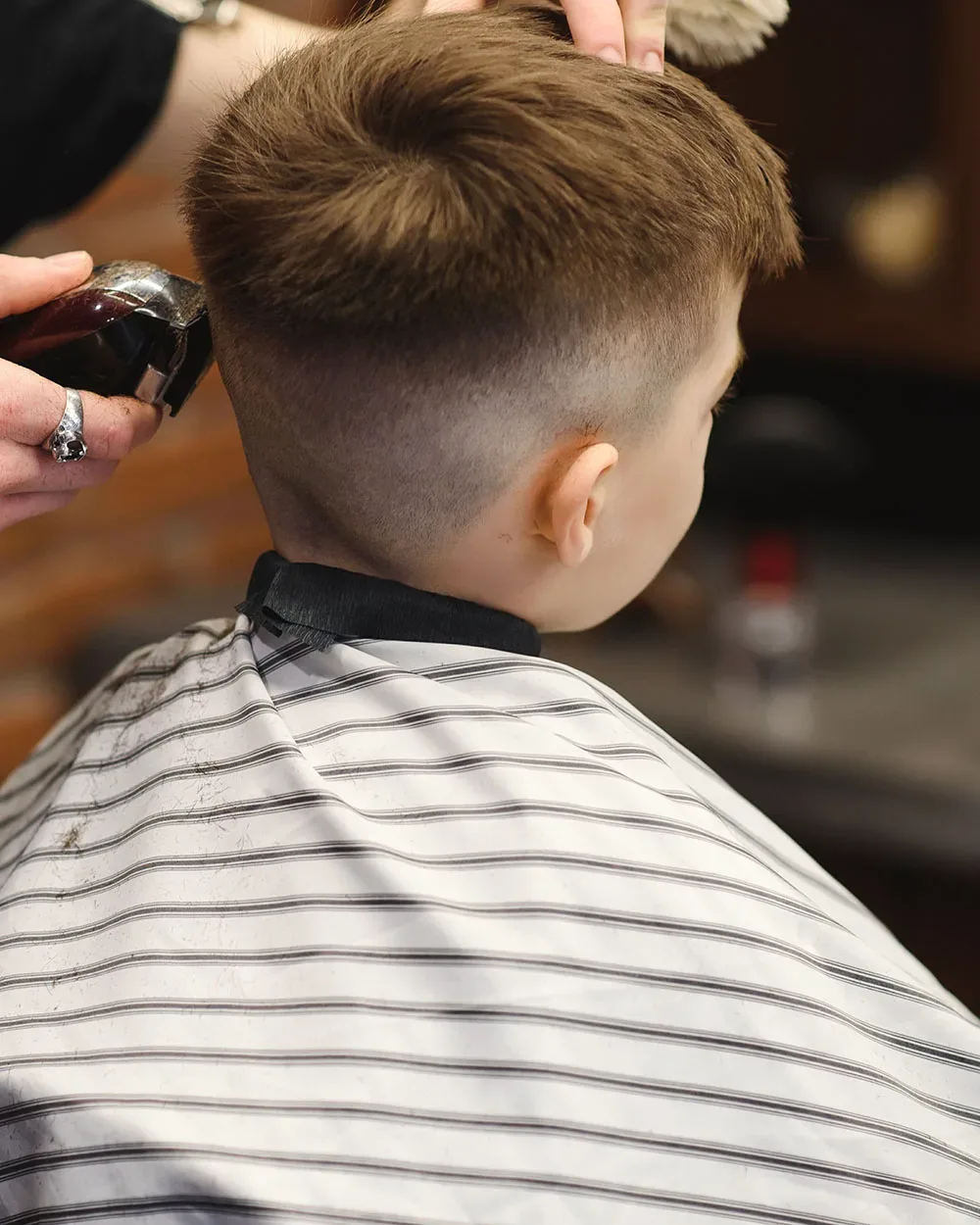 Children's haircut in progress at Jeannie's Hair Care Studio