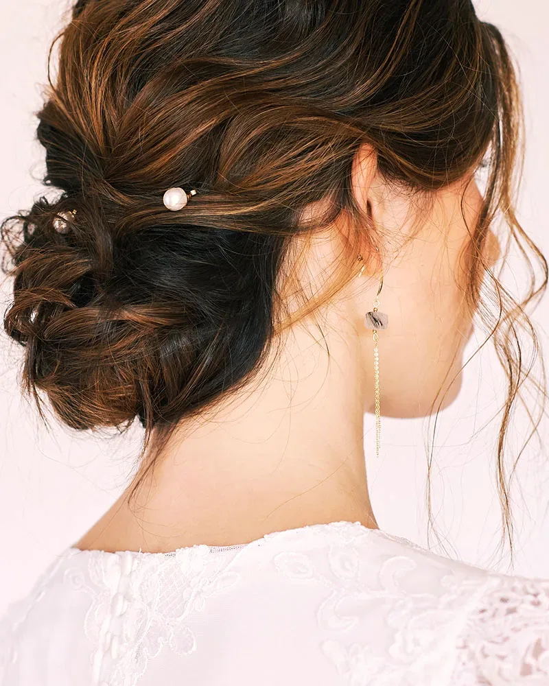 Romantic formal updo with soft twists, rear view