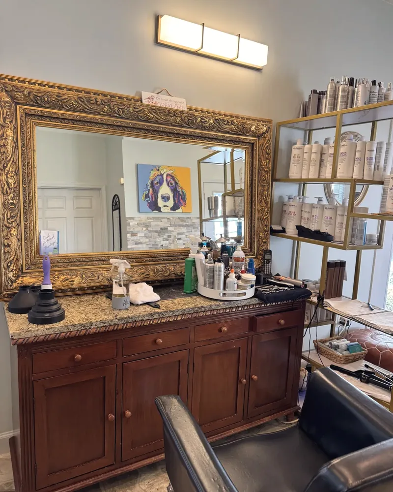 Styling station with a gilt mirror at Jeannie's Hair Care Studio in Charleston, WV