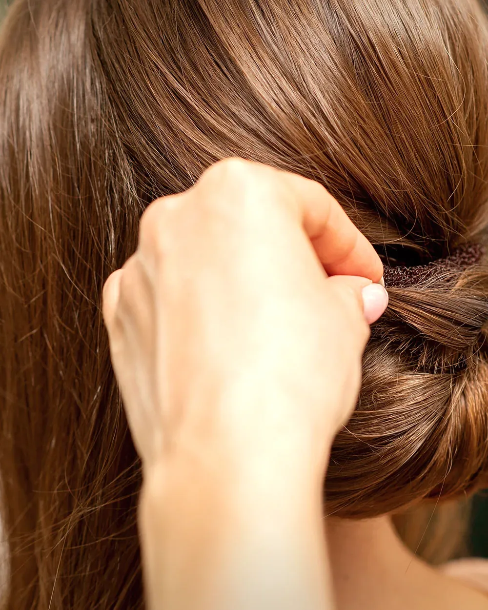 A wedding updo being pinned at a Charleston, WV hair salon